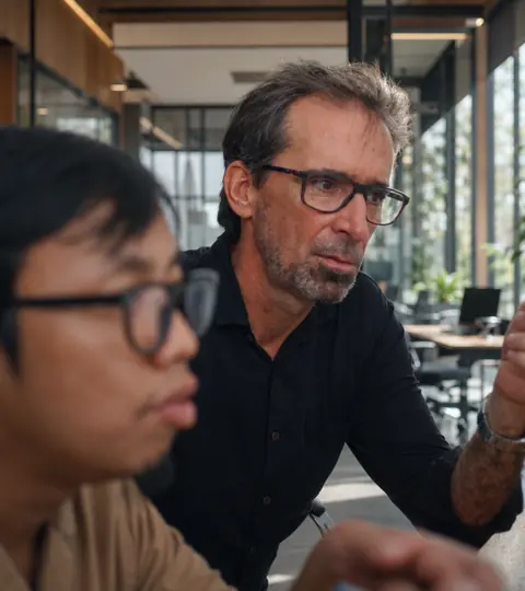 Doodex founder reviewing an Odoo module on screen with a developer
